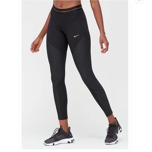 nike training icon clash leggings in black and gold
